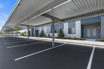Covered parking carport with commercial building facade
